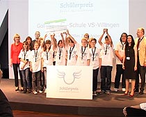Schler mit groem Scheck